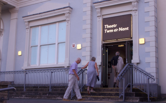 audience entering the front door